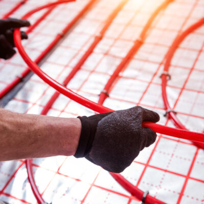 Pipefitter,Install,System,Of,Underfloor,Heating,System,At,Home